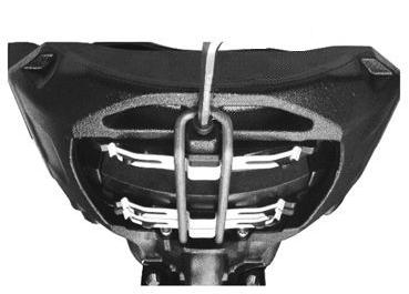 Press the brake pad hold-down bracket against the brake caliper and fasten the socket