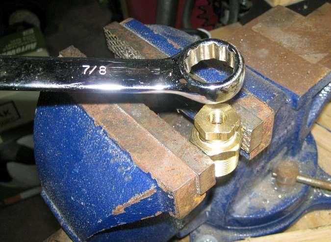 Use a vise to hold the large ¾ to ½ NPT