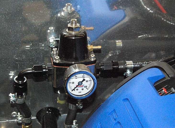 Push the ⅜ fuel line onto the right side of the regulator then attach a hose clamp and run it over to the engine fuel rail. Fuel lines Push the white fuel line connector onto the fuel rail.