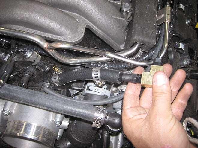 Push the ½ side into the short section of ½ hose and fasten with a hose clamp. Slide a second hose clamp onto the hose.