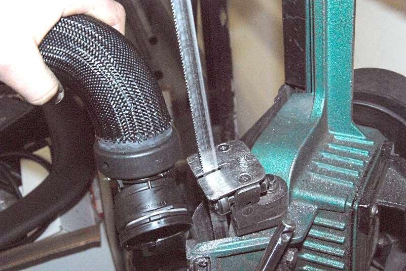 Remove the stainless hose and cut it where marked with a