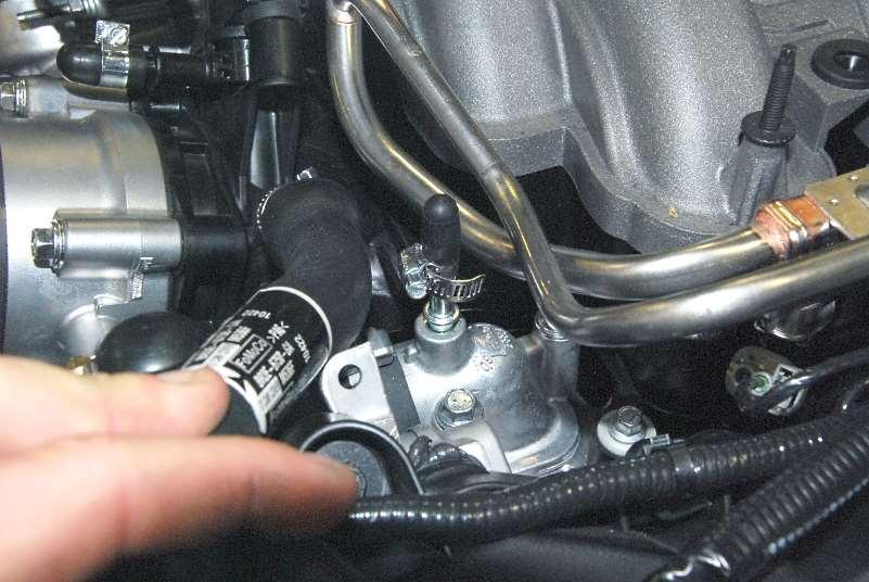 For air bleeding later, remove the 90 plastic coolant hose adapter until