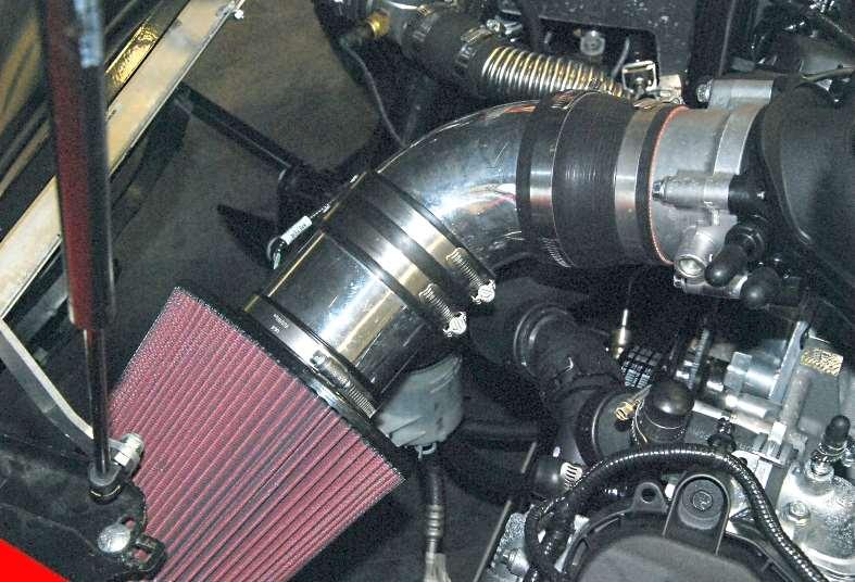 Push the intake tube onto the throttle body and position the