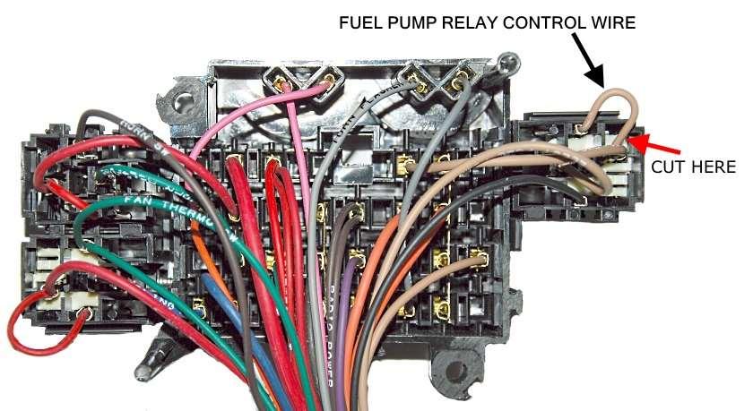 On the chassis harness, cut the small tan jumper wire close to connector that it jumpers from and connect the fuel