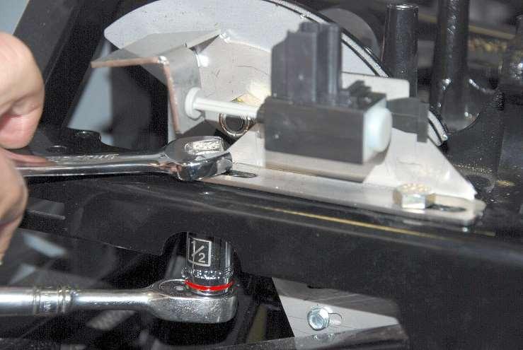 Snug the bolts up with a ½ wrench and socket so the bottom travel switch bracket can