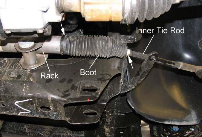 Slide boot to expose rack and inner tie rod. Illus.