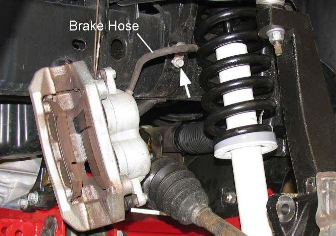 5) Attach right brake hose 170109 to the caliper with new washers and the original banjo bolt. See illustration 25. Tighten the bolt to 20 ft. lbs.
