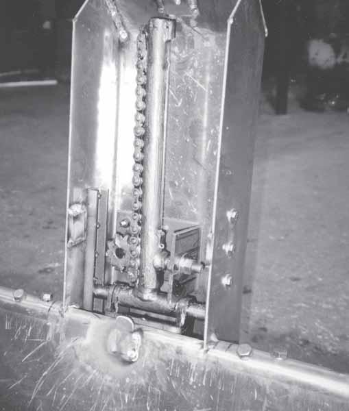 For units built prior to 1999, (see figure 8-40) the tracking chain must be positioned snugly against the sprocket to prevent tooth jumping or jamming.