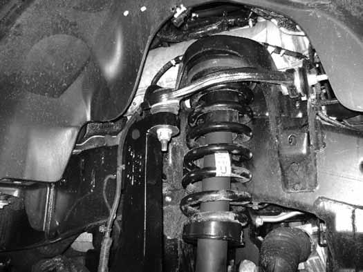 Fig 26 67. Torque the upper strut nuts to 35 ft-lbs. The lower bolt will be tightened later with the weight of the vehicle on the suspension. 68. Fasten the CV shaft to the hub with the original nut.