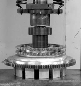 Now remove the old bearing using JIMS tool No. 971 along with arbor press. See Fig 4 12. Use the same tool to install the new bearing as shown. See Fig 5 13. Using the press and JIMS tool No.