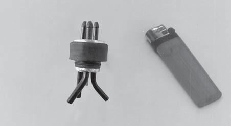 This tube is the vent tube. When the stopper assembly is installed in the tank, the top of the vent tube should rest just below the top surface of the tank.