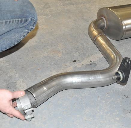 Install the hanger grommet assembly onto the front hanger of the muffler assembly in the same position as previously