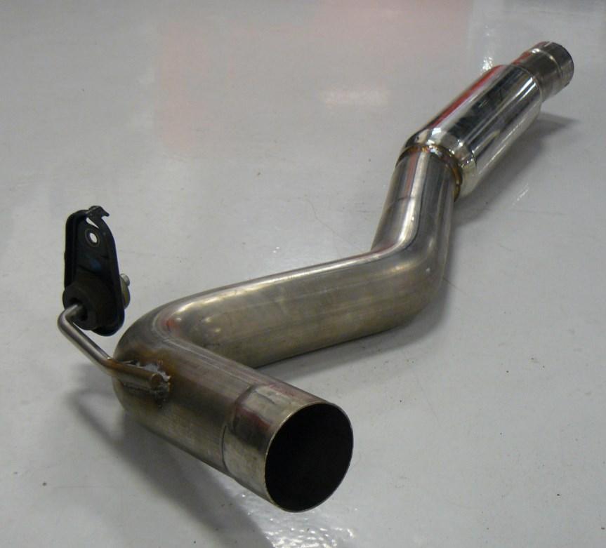 The passenger side axle tube (part XJ) is shown with the factory hanger pre-installed by the arrow in Figure