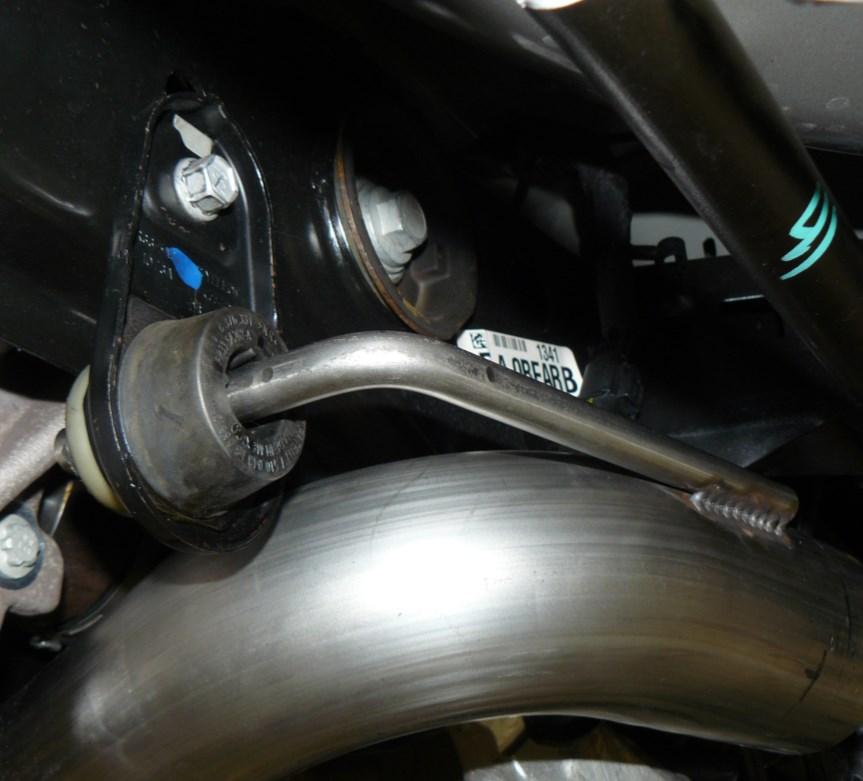 Install the AWE H-Pipe section (part XE), reusing the original sleeve clamps that were loosened in Step 1.