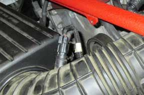 Step 3: For vehicles with a vacuum pump, unscrew the vacuum pump from the stock housing, located beside the intake tube 2.