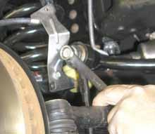 While supporting front axle with a floor jack, remove the front tires / wheels. 4.