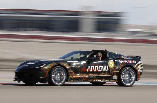 Schmidt uses head motions to control the car's direction. (AP Photo/Isaac Indy Racing League driver Sam Schmidt practices driving his modified Corvette on Tuesday, Sept.