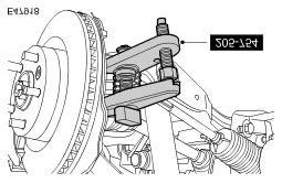 CAUTION: To prevent the wheel knuckle falling outwards and disconnection of the halfshaft inner joint, support the wheel knuckle. Loosen the upper arm retaining nut.