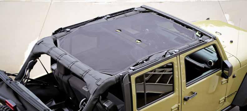 The full-length sun shade is secured between the windshield and the rear crossbar of the JK sport bar to protect both front and rear passengers simultaneously.