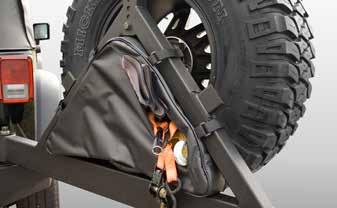 Once installed, the linkage mates the tire carrier to the tailgate, so both open in a single fluid movement.