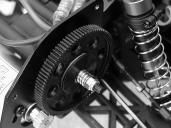 Adjusting the Spring Tension By adjusting the spring tension of the shocks, you can increase steering sensitivity and increase the ride-height of the truck.