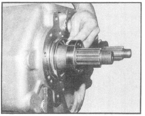 Place underdrive gear in housing with clutch face facing the inside of the housing. Slide the gear onto intermediate shaft installation tool. 6.