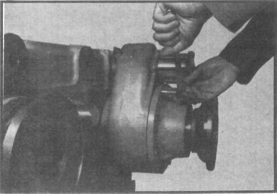 Remove plunger from inside PTO/declutch housing using a magnet. Fig. 3 4. Remove four capscrews from PTO/declutch cover plate, and tap plate to loosen.