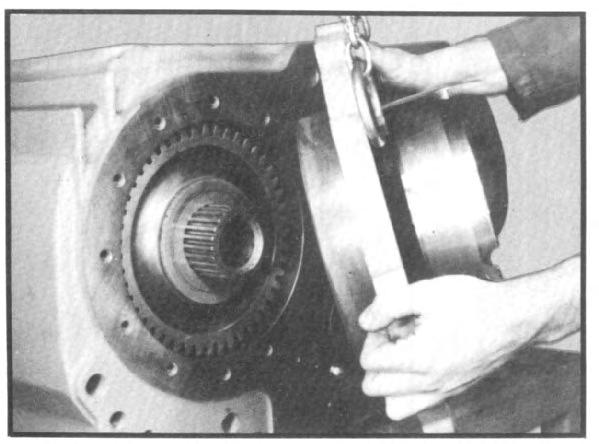 chain. (See fig. 52.) The face plate can then be worked out of transfer case housing, supported by the chain hoist. (See fig. 53.) V.