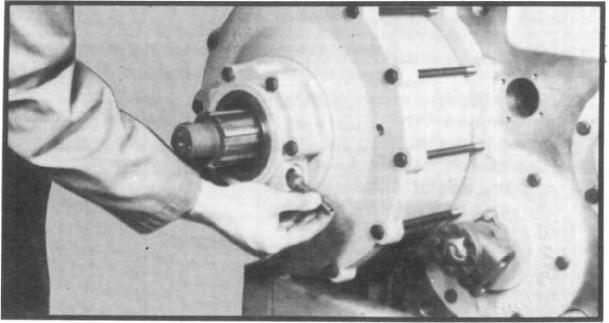 VII. TRANSFER CASE ASSEMBLY 2.29 Install speedometer drive gear into seal carrier to mesh correctly with drive gear. (See fig. 137.) 2.30 Install speedometer sleeve, tightening securely. 2.31 Coat the hub of the output flange or yoke with gear lubricant and slide the flange or yoke onto rear output shaft.