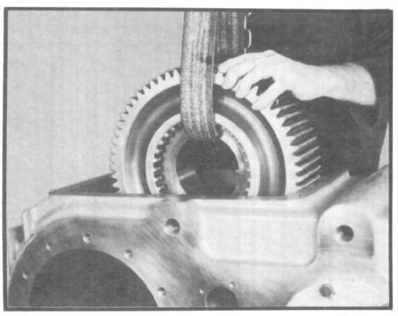 VII. TRANSFER CASE ASSEMBLY 3.5 Place underdrive gear in housing with clutch face inward. (See fig. 141.) Fig. 141 3.