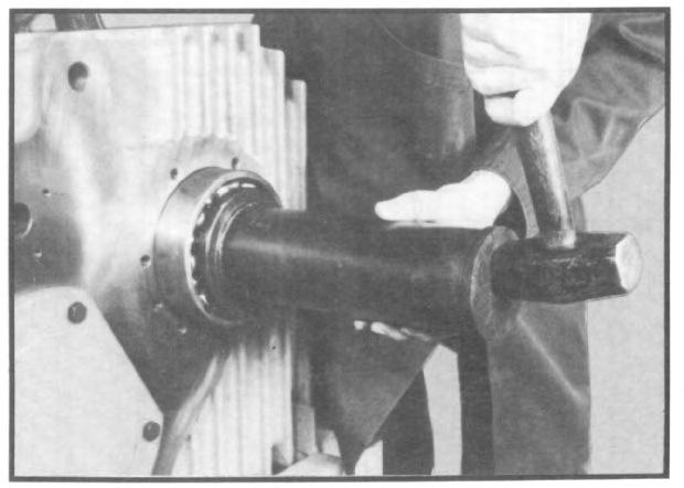 Place flat side of washer against the gear. Fig. 142 3.7 Install lower shaft front ball bearing on front of shaft.