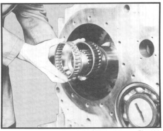 VII. TRANSFER CASE ASSEMBLY 3.8 Slide clutch gear onto front of shaft and secure to shaft with special nut. (See fig.