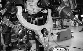 Install the factory lower control arms to the Fabtech crossmembers using