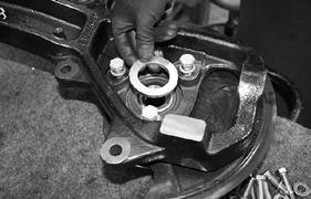 33. Install the new knuckle by installing it to the lower ball joint first.