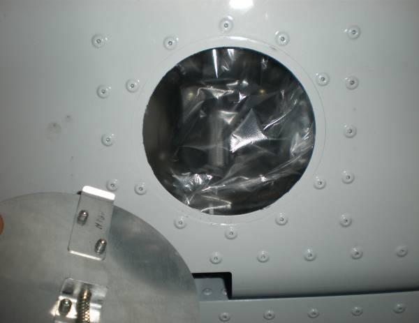Remove the covers of the access holes in the outer skin of the airplane.
