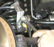 (See Photo # 1) Disconnect the upper brake line bracket from the upper coil bucket & disconnect the brakeline bracket from the front differential. 5.