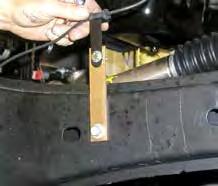 19. Install the OEM bump stops into each OEM bump stop cup. 20. Attach the new Skyjacker track bar bracket to the frame using the OEM hardware.