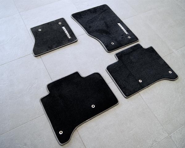 Accessories exclusive floormat set left-hand drive vehicles in deep-pile velours black with embroidered HAMANN-logo in silver and nubuck border including double contrast stiching Order-No.