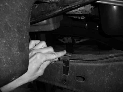 Figure 6B 11. Disconnect the steering drag link from the pitman arm. Remove the cotter pin and castellated nut cap. Remove the nut and thread back on by hand a couple turns.