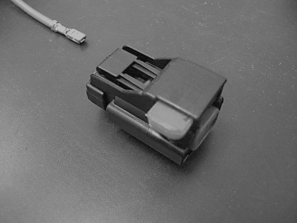 Fig 11 Connect power wire to this lug Fig 10 Fig 11 Install the black two pin power connector on the subwoofer power harness by first inserting the terminal fully into the connector and then