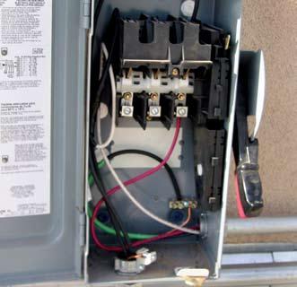 operation of the inverter. Larger inverters and inverters designed for transformerless or bipolar operation may require additional certification that they cannot backfeed. Photo 2.
