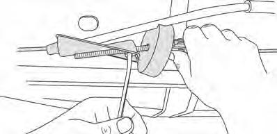 Install Brake Cable Bracket - Quad Cab Only Depress the locking tabs on the brake cable guide and slide it out through the hole in the frame.
