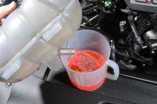 Drain the coolant from the tank into a clean container.