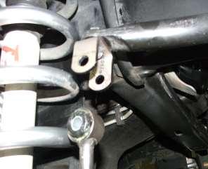 38) Attach the upper end of the sway bar end link to the bottom of the