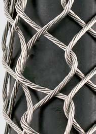 Leave a space between adjoining loops approximately equal to the width of one diamond of the mesh. 3. Twist the lacing strands tightly together at the tail end of the grip. 4.