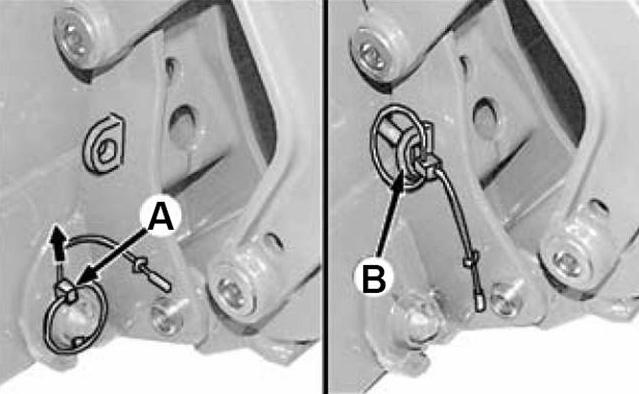 Extend bucket tilt cylinders to angle attaching brackets forward. NOTE: Angle must be greater than that of the brackets on the rear of the pallet fork.