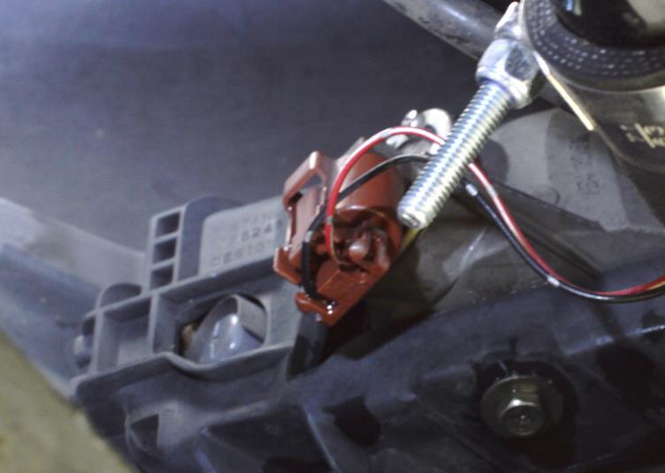 g) Unplug the wiring harness from each fog light and unclip the wiring from the bumper. Circled in red in Figure 2d.