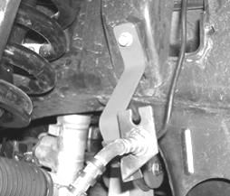 Locate the new FT30065 brake line bracket and attach to the frame using the original factory bolt, attach the factory brake line bracket to the new Fabtech bracket using the supplied 5/16 x 1 nut,