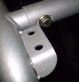 If installing floor mount kit: use four more kit button head bolts, two on each side and thread into the top