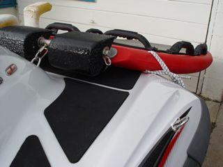 Step 6. The left and right side bungees are connected to the left and right bow eye cleats via spring clips. The bungee cords come pre-looped and knotted.